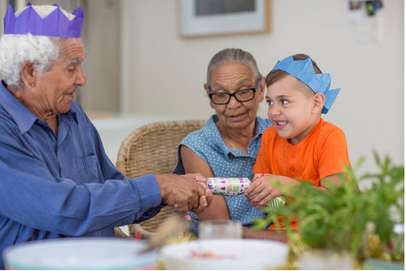 Senior couple taking care a young boy