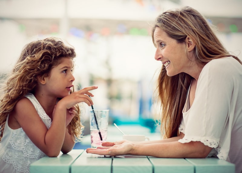 Mother talking to her daughter