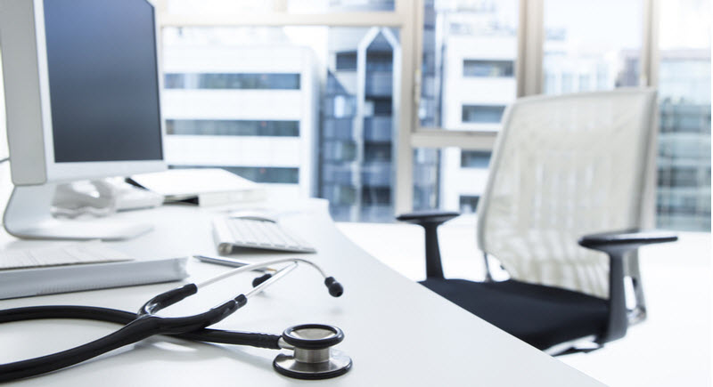 Empty table of a doctor with a stethoscope